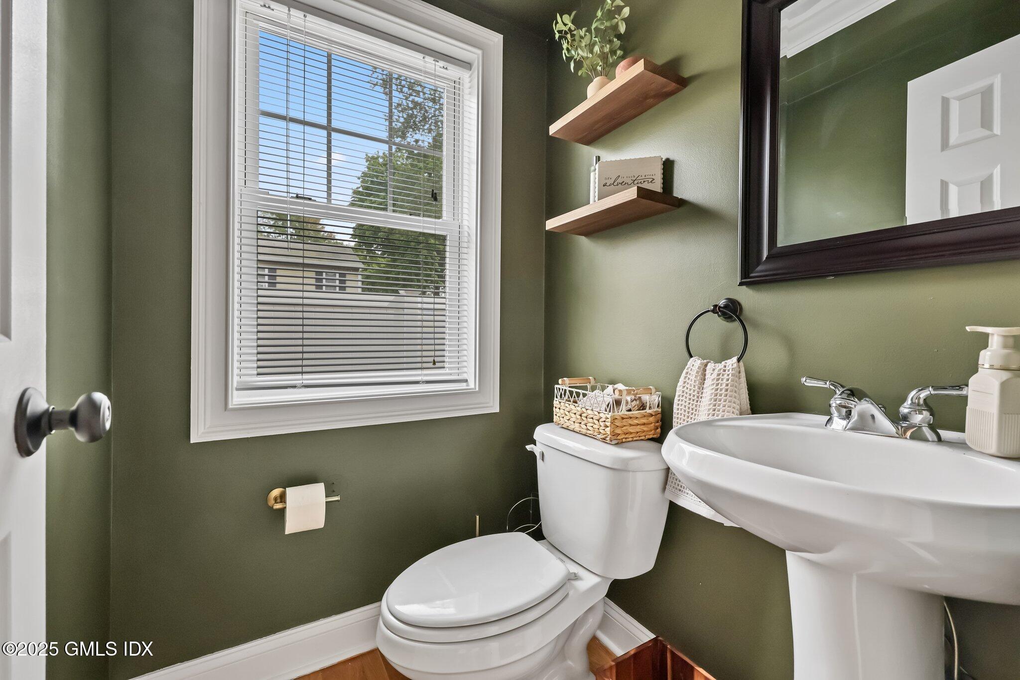 39 Maple Tree Avenue, Unit 16 Stamford, CT 06906 - Photo 7 of 21 a bathroom with a sink a toilet and a mirror