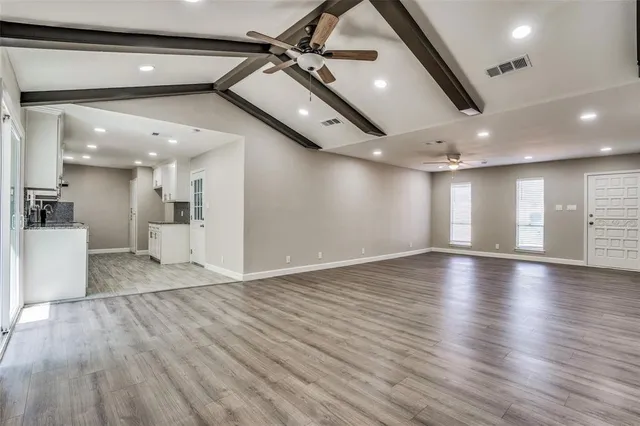 a view of a livingroom with wooden floor