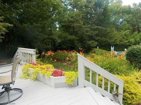 30065 Bolingbrook Road Pepper Pike, OH 44124 - Photo 30 of 33 Flower boxes and beds of perennials decorate the deck and yard.