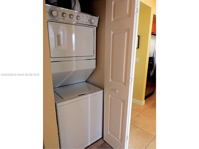 888 Douglas Road, Unit 1016 Coral Gables, FL 33134 - Photo 18 of 34 a utility room with dryer and washer