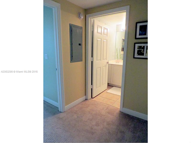 888 Douglas Road, Unit 1016 Coral Gables, FL 33134 - Photo 19 of 34 a view of a hallway with wooden floor and entryway