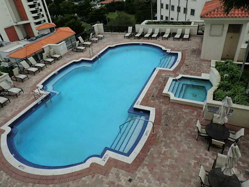 888 Douglas Road, Unit 1016 Coral Gables, FL 33134 - Photo 24 of 34 a view of a swimming pool with lounge chair