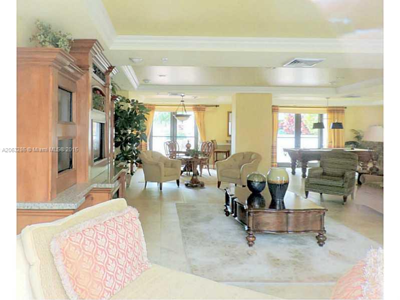 888 Douglas Road, Unit 1016 Coral Gables, FL 33134 - Photo 27 of 34 a living room with furniture and a table
