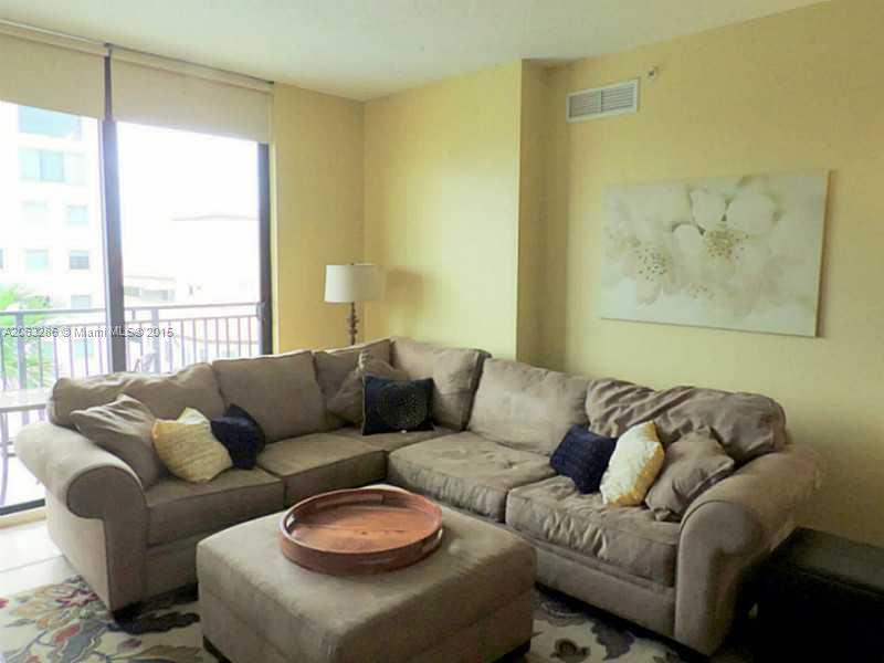 888 Douglas Road, Unit 1016 Coral Gables, FL 33134 - Photo 7 of 34 a living room with furniture and a large window