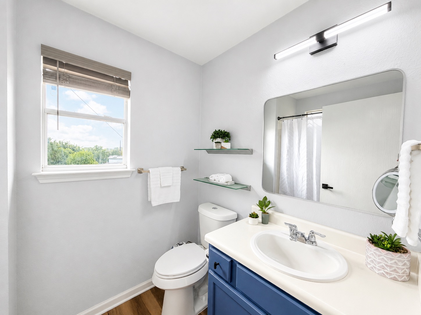 5405 Rusk Court Austin, TX 78723 - Photo 24 of 40 A modern primary bathroom with a shower tub combination awaits you.