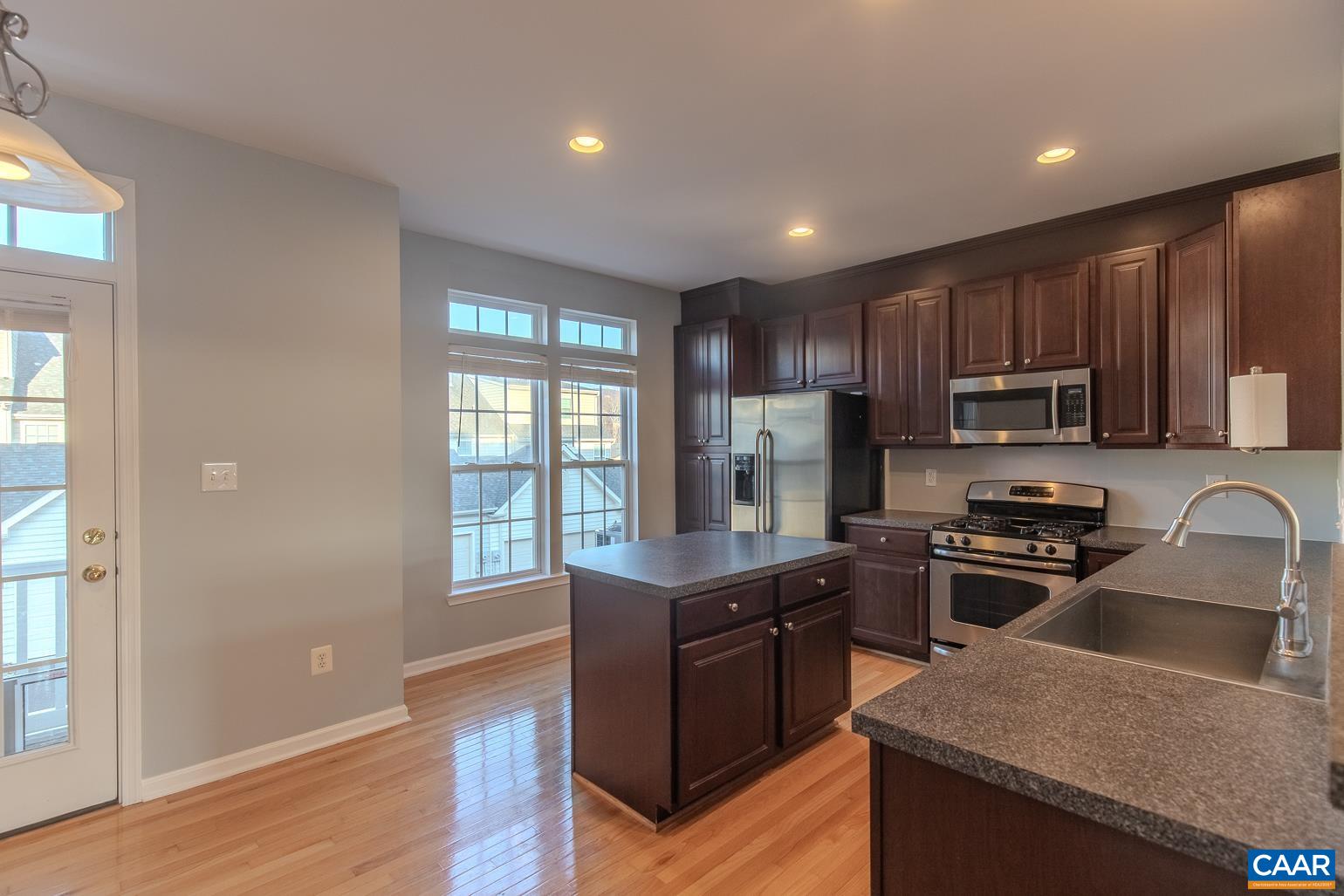 339 Rolkin Road Charlottesville, VA 22911 - Photo 13 of 43 a kitchen with granite countertop stainless steel appliances cabinets a sink and a window