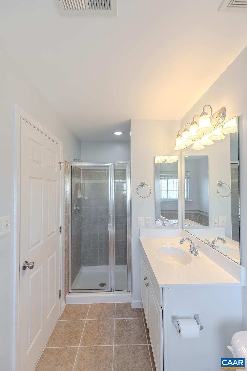 339 Rolkin Road Charlottesville, VA 22911 - Photo 24 of 43 a bathroom with a tub shower and sink