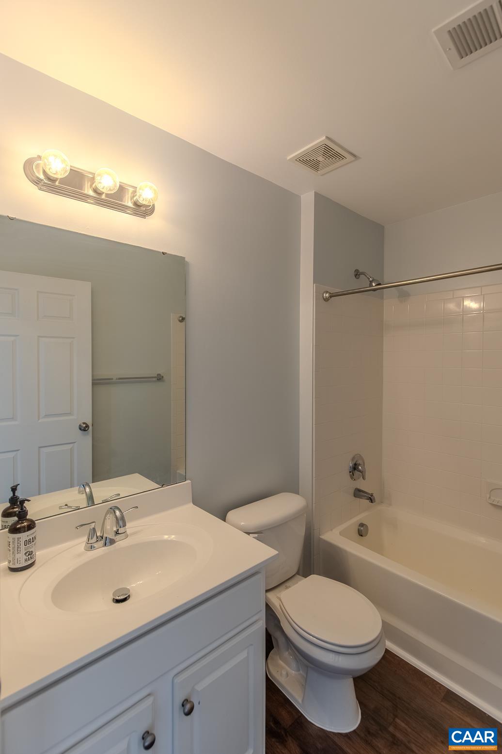 339 Rolkin Road Charlottesville, VA 22911 - Photo 28 of 43 a bathroom with a sink toilet vanity and shower