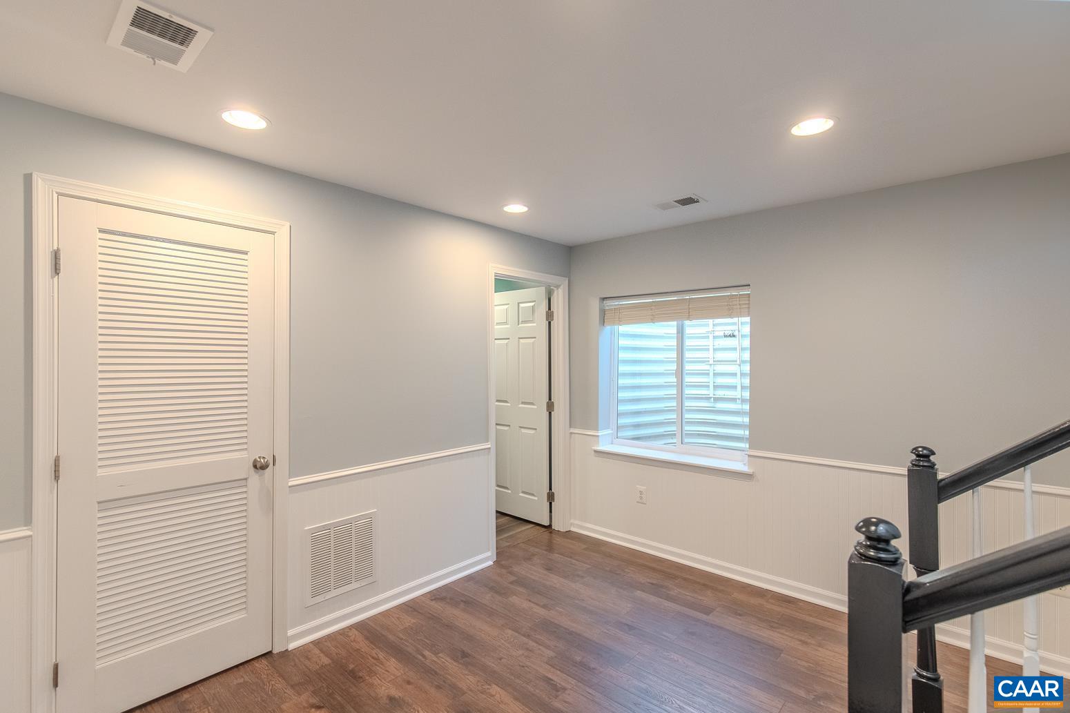 339 Rolkin Road Charlottesville, VA 22911 - Photo 37 of 43 a view of an empty room with wooden floor and a window