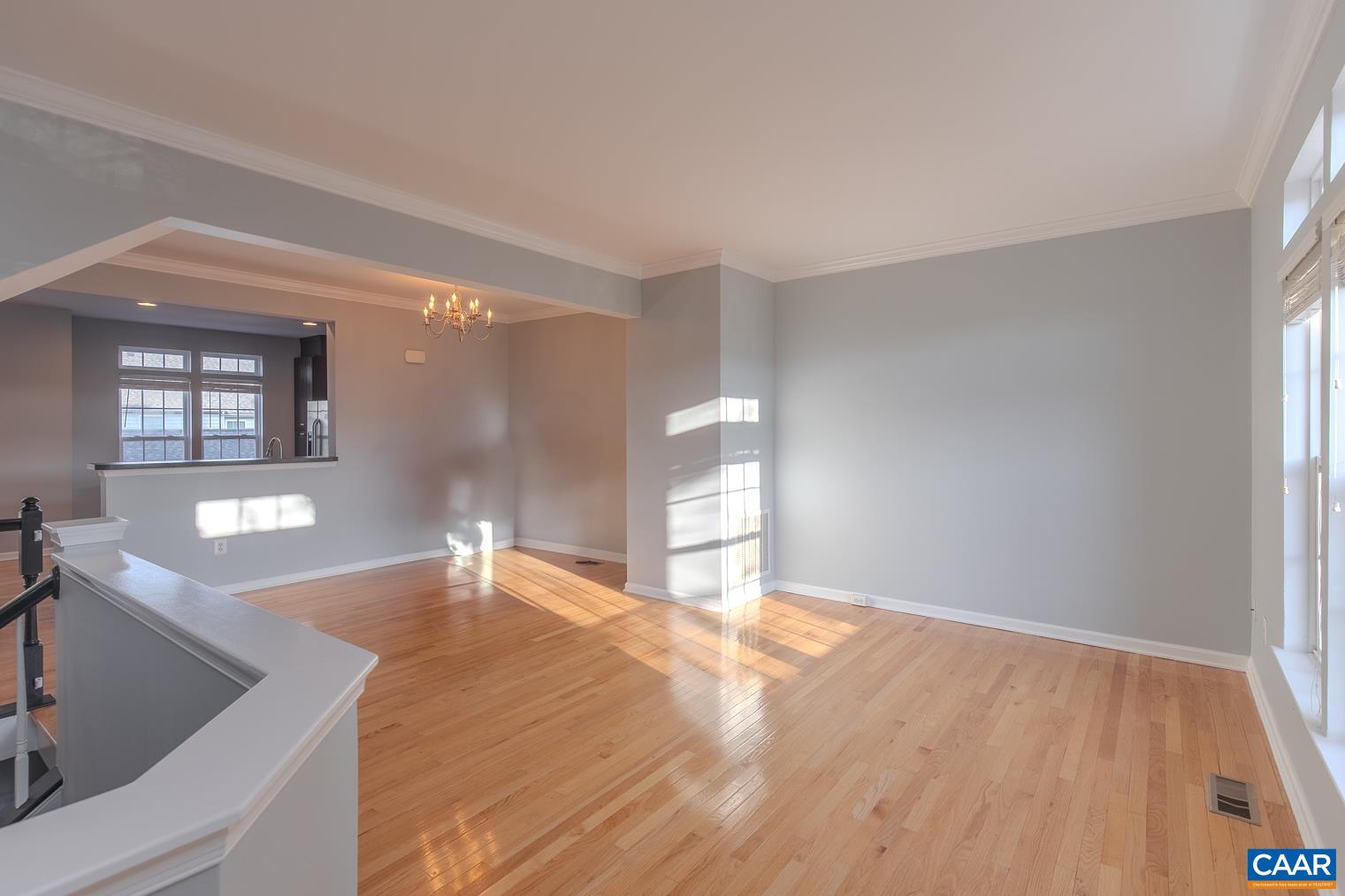 339 Rolkin Road Charlottesville, VA 22911 - Photo 4 of 43 a view of empty room with window and wooden floor