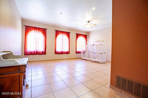 480 Camino Ramanote Rio Rico, AZ 85648 - Photo 19 of 43 Across from the kitchen is a large family room, available for multiple-uses.