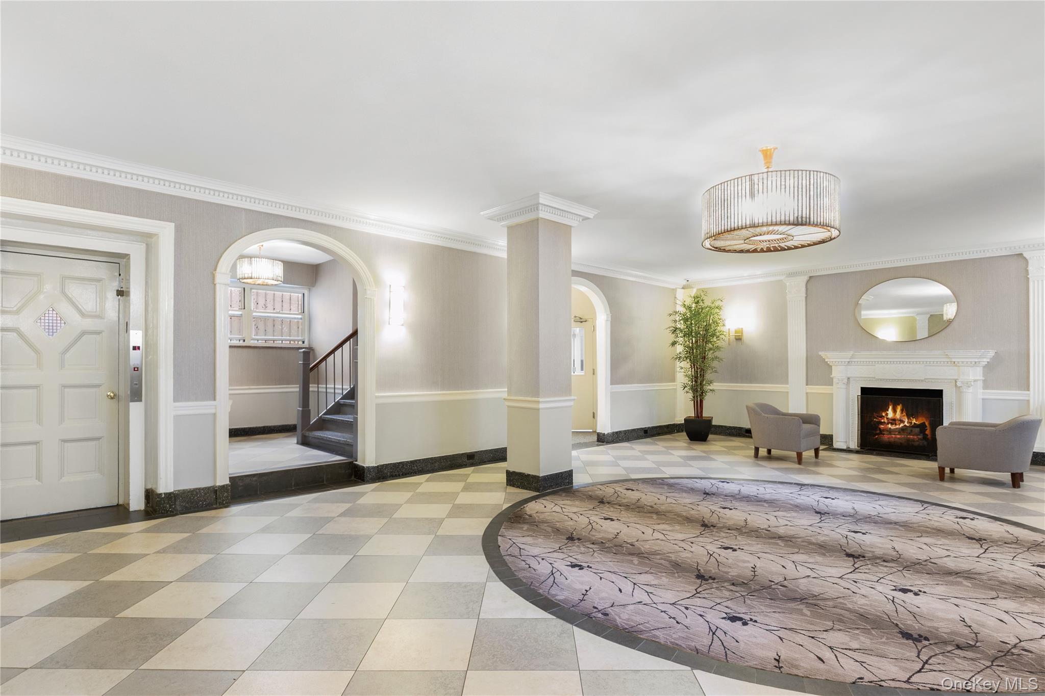 110-55 72nd Road, Unit 106 Queens, NY 11375 - Photo 2 of 10 a view of a livingroom with a fireplace a chandelier and window