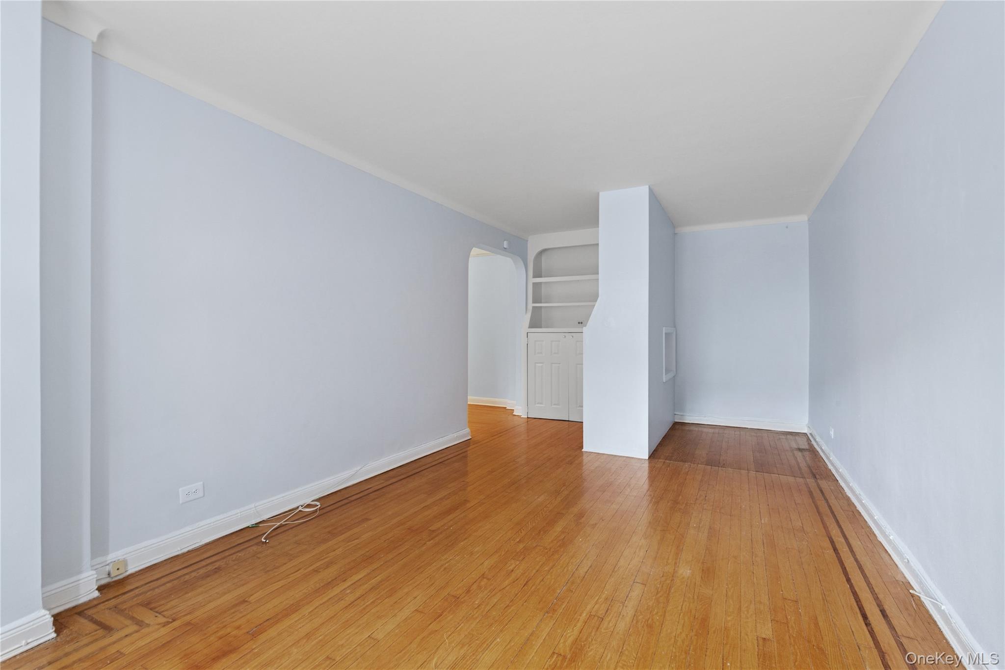 110-55 72nd Road, Unit 106 Queens, NY 11375 - Photo 9 of 10 a view of empty room with wooden floor
