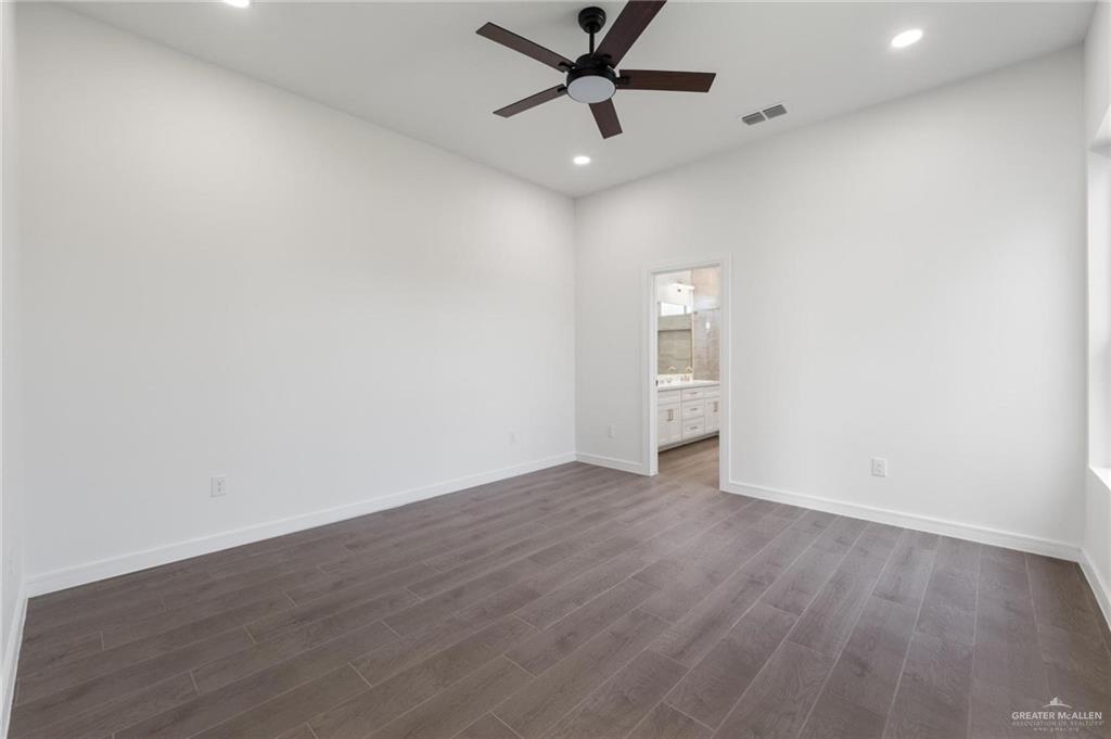 505 Freedom Way Weslaco, TX 78596 - Photo 14 of 20 wooden floor in an empty room