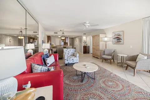 a kitchen with granite countertop sink stove and cabinets