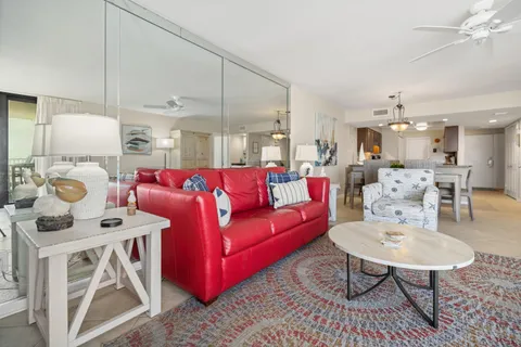 a kitchen with a sink a stove and cabinets