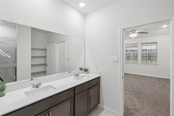 a bathroom with a glass shower door