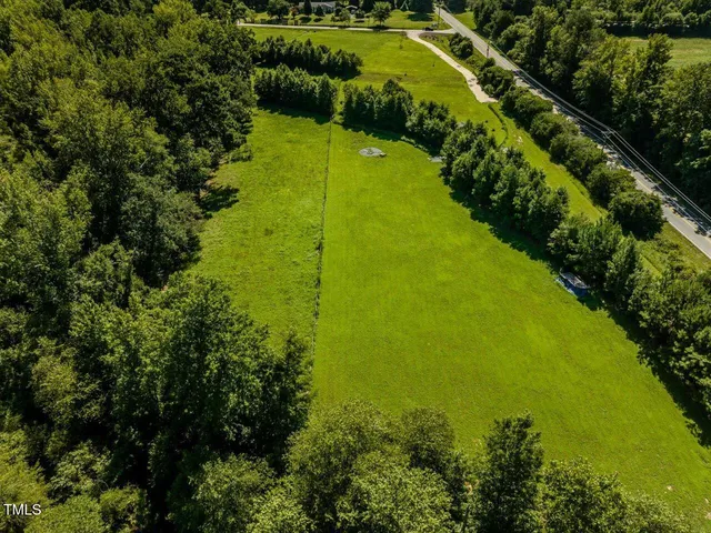 a view of a lake with a yard