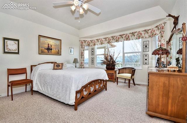 12208 Stanley Canyon Road Colorado Springs, CO 80921 - Photo 11 of 27 Master bedroom suite with constant views for rooms on the west side of house.