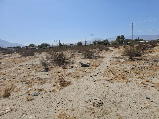 a view of ocean beach and mountain