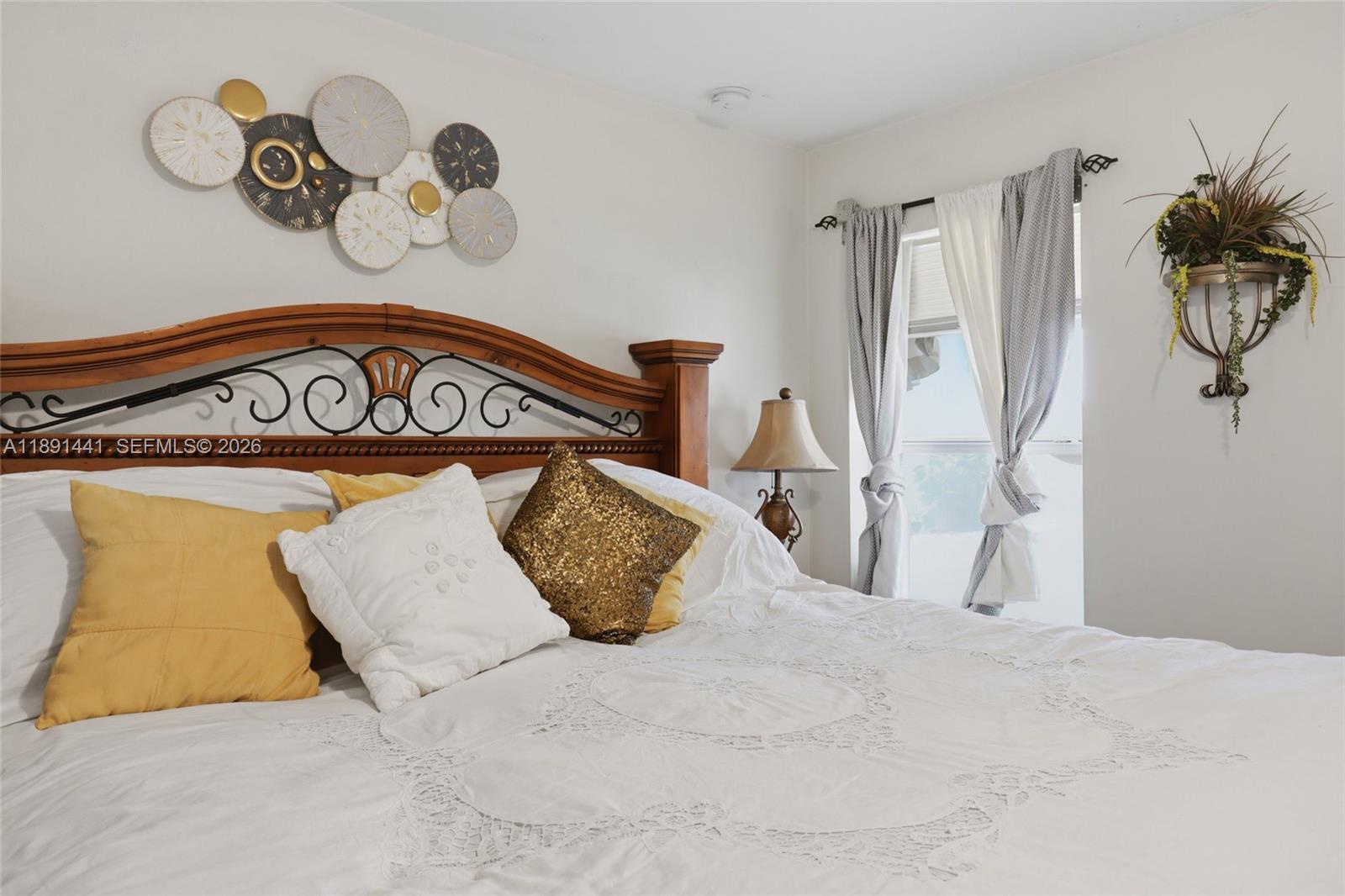 3003 25th Street West Lehigh Acres, FL 33971 - Photo 19 of 39 a bedroom with a bed and a painting on the wall