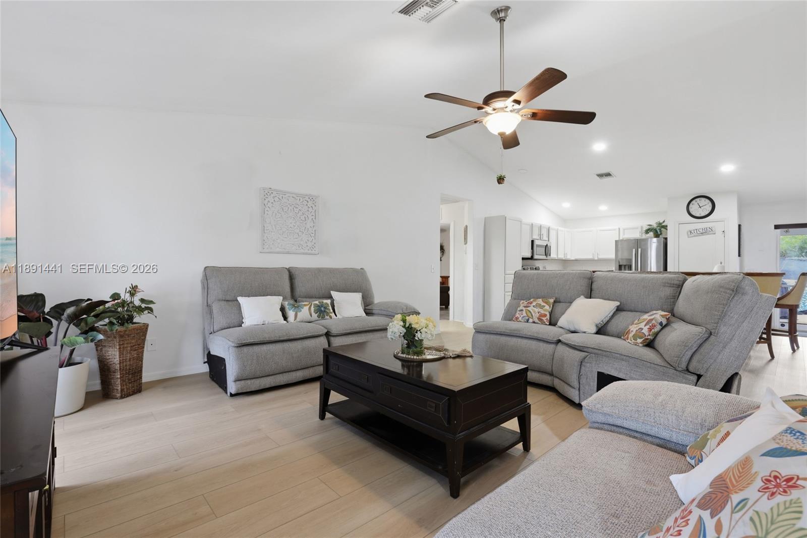 3003 25th Street West Lehigh Acres, FL 33971 - Photo 2 of 39 a living room with furniture and kitchen view