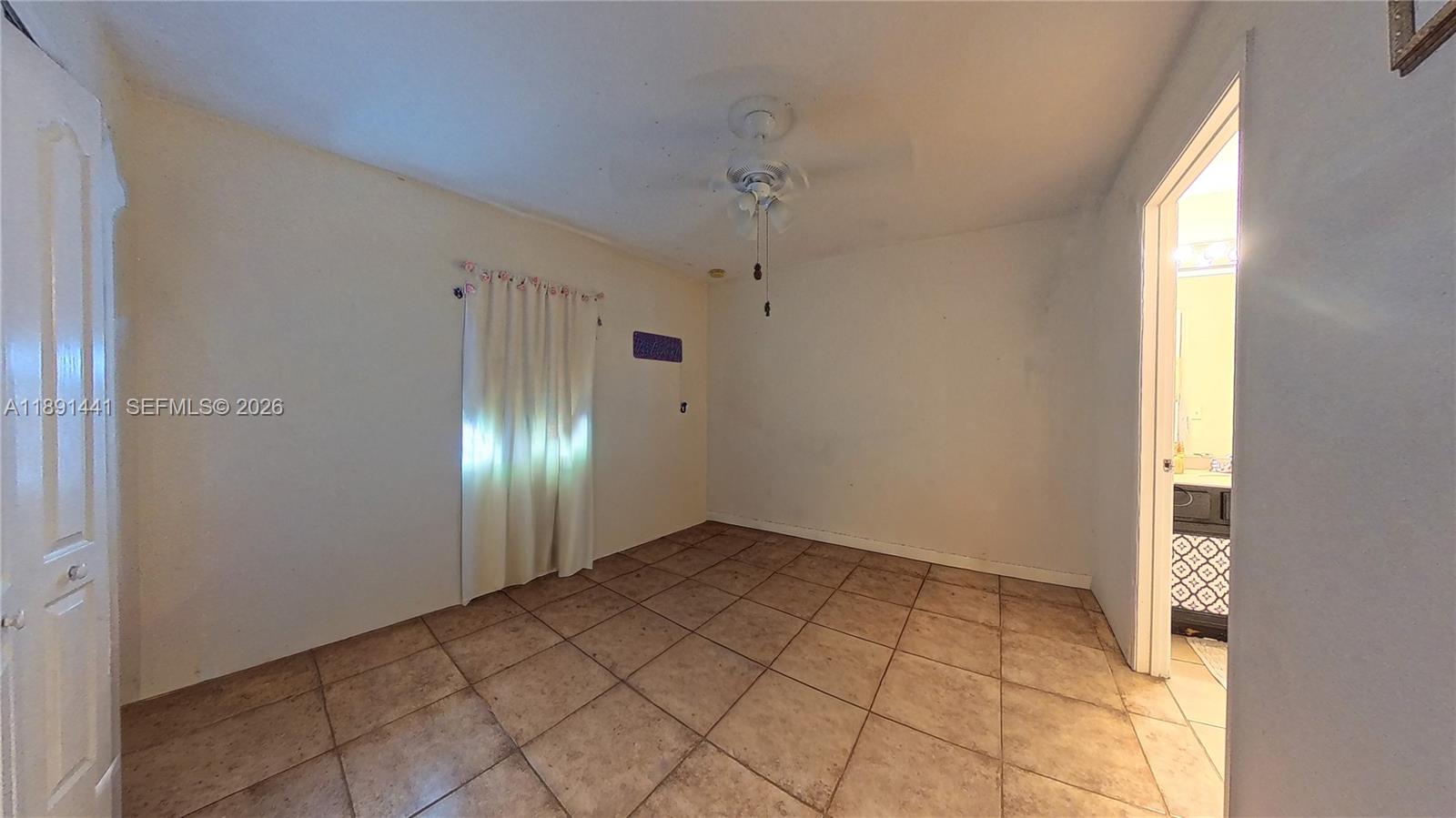 3003 25th Street West Lehigh Acres, FL 33971 - Photo 25 of 39 a view of an empty room and window