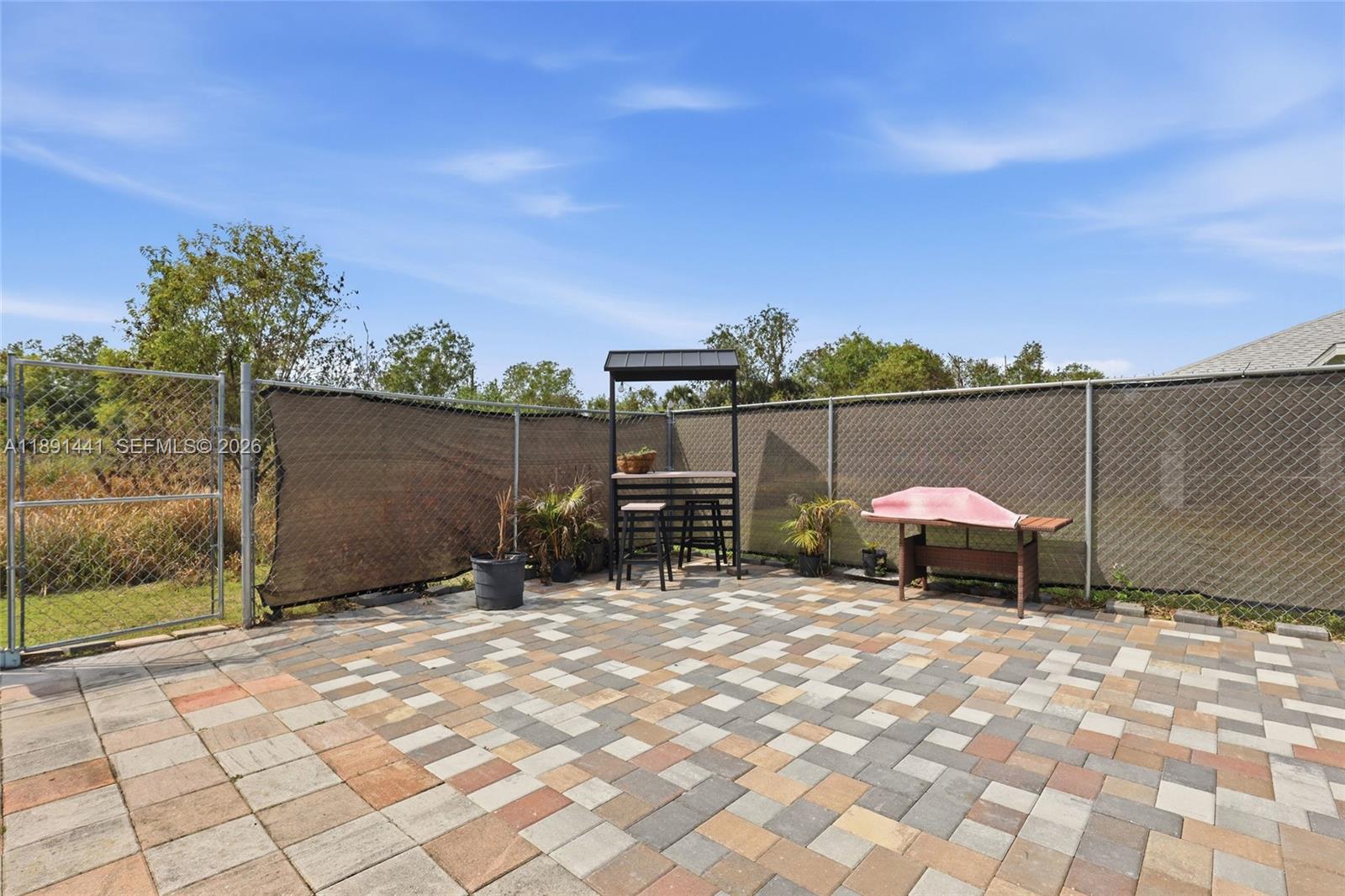 3003 25th Street West Lehigh Acres, FL 33971 - Photo 33 of 39 a view of a outdoor space with seating area