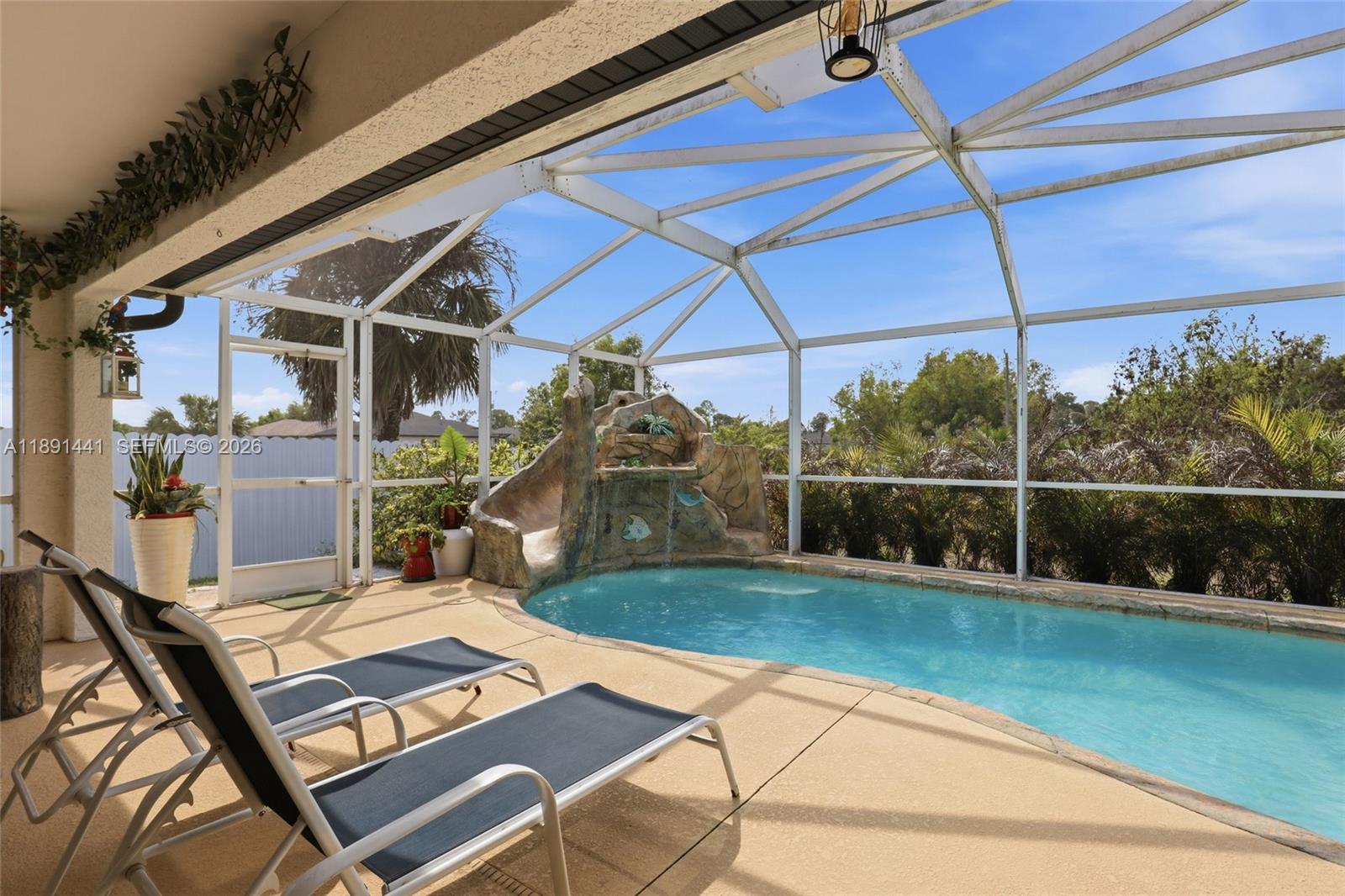 3003 25th Street West Lehigh Acres, FL 33971 - Photo 38 of 39 a view of backyard with a patio