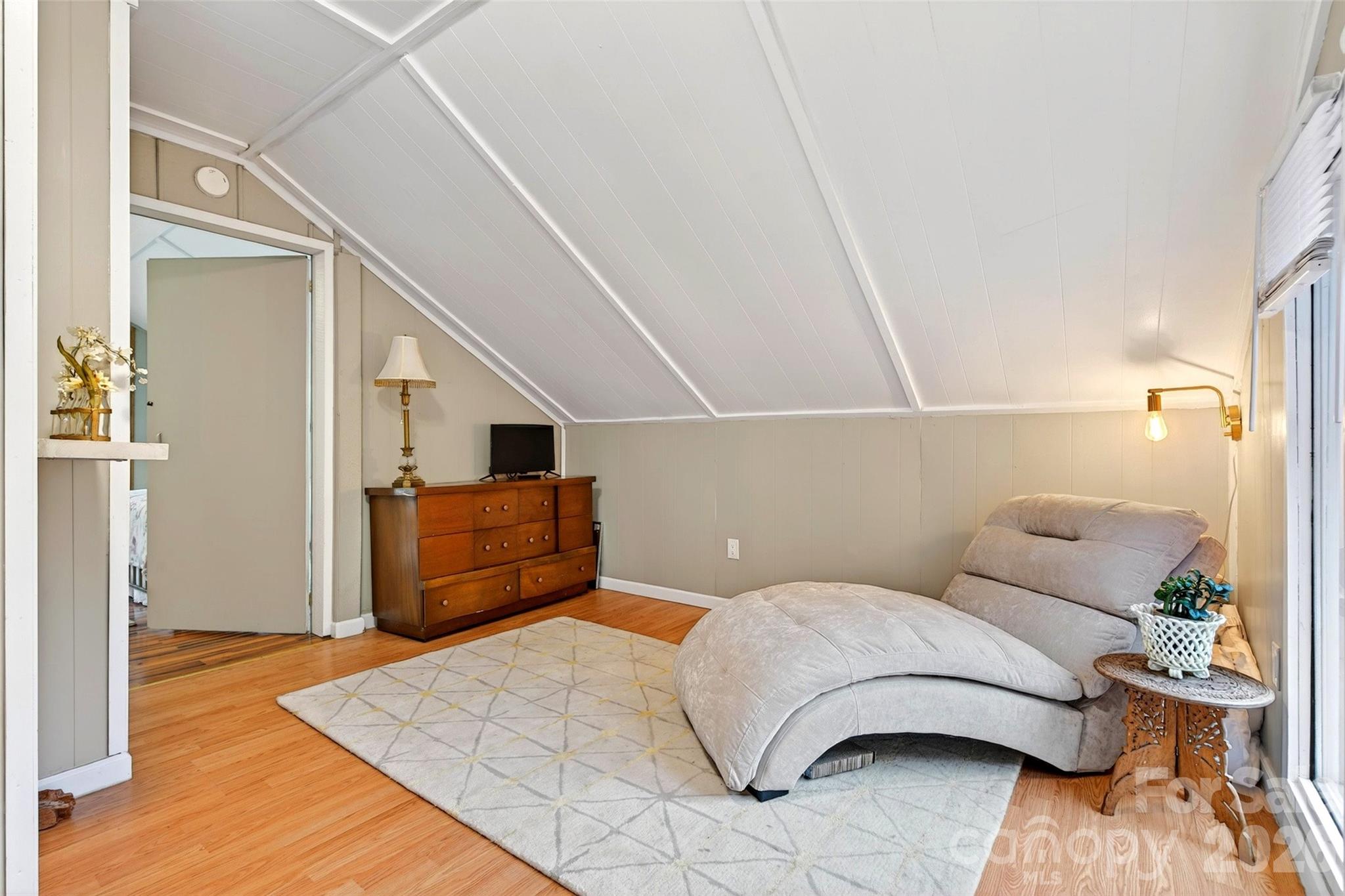 227 Locust Cove Road Marion, NC 28752 - Photo 14 of 34 a bedroom with a bed and a couch
