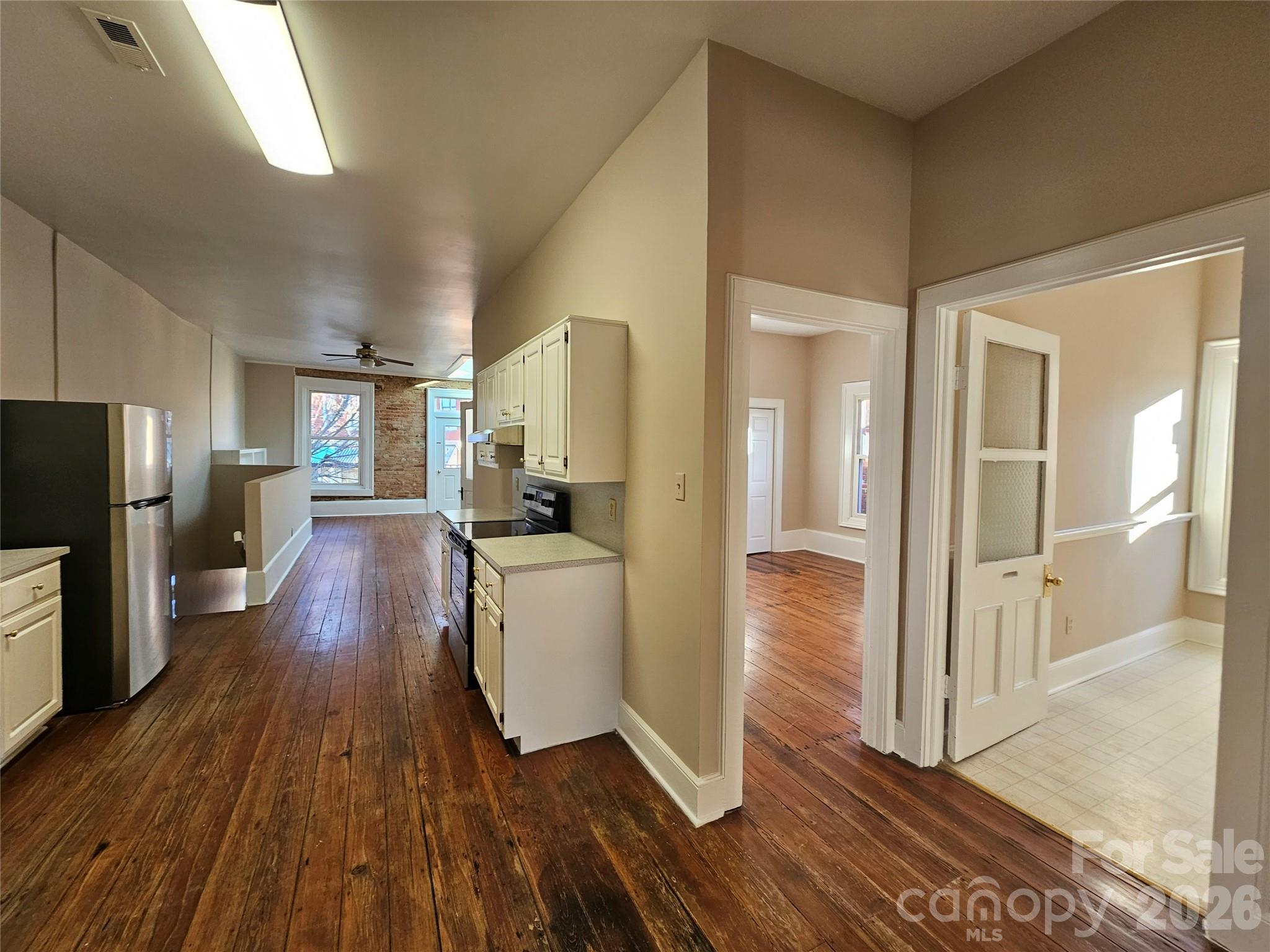 107 Gadsden Street, Unit A&B Chester, SC 29706 - Photo 2 of 20 a view of a hallway view with wooden floor and living room