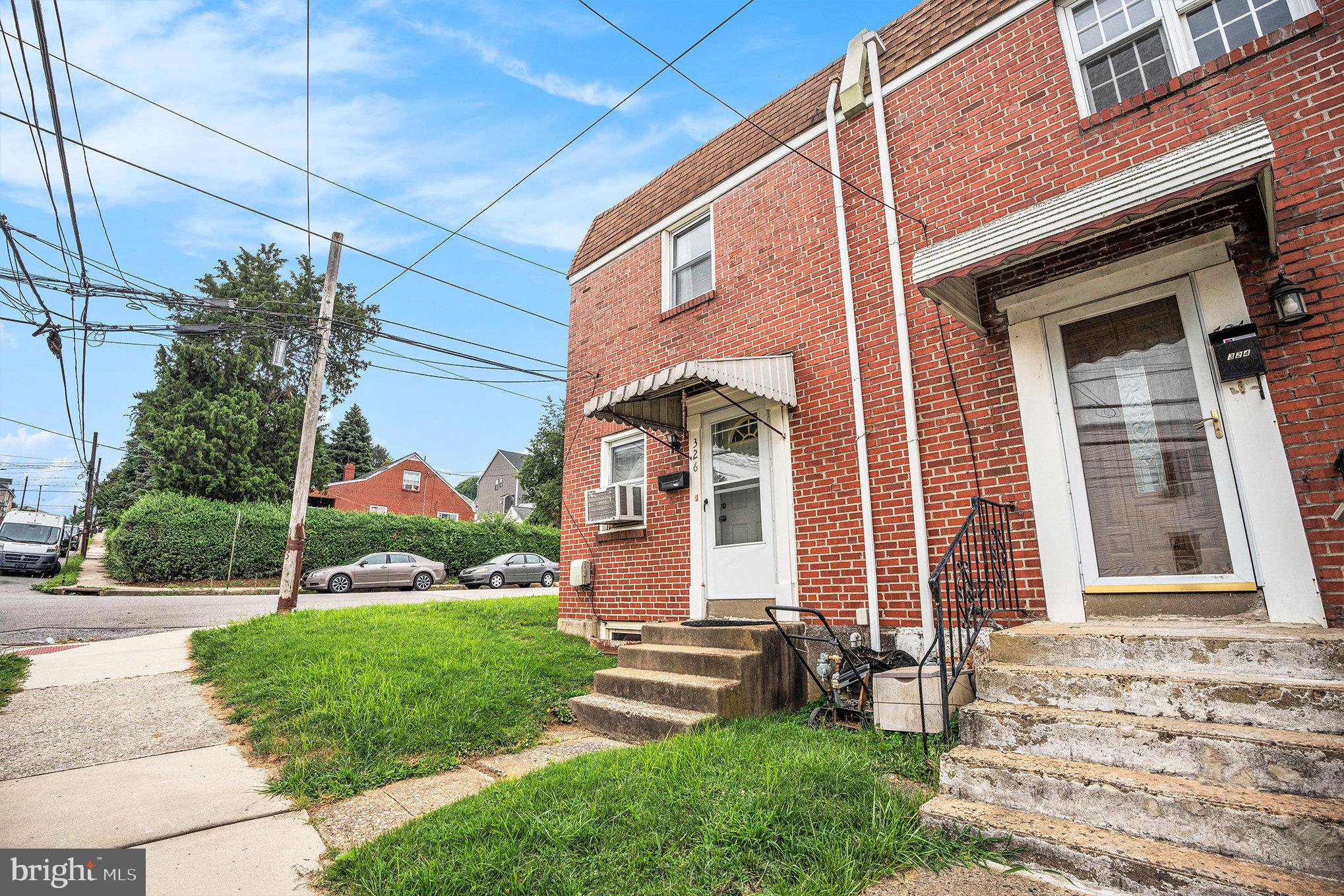 326 East Rambo Street Bridgeport, PA 19405 - Photo 12 of 26 a front view of a house with a yard