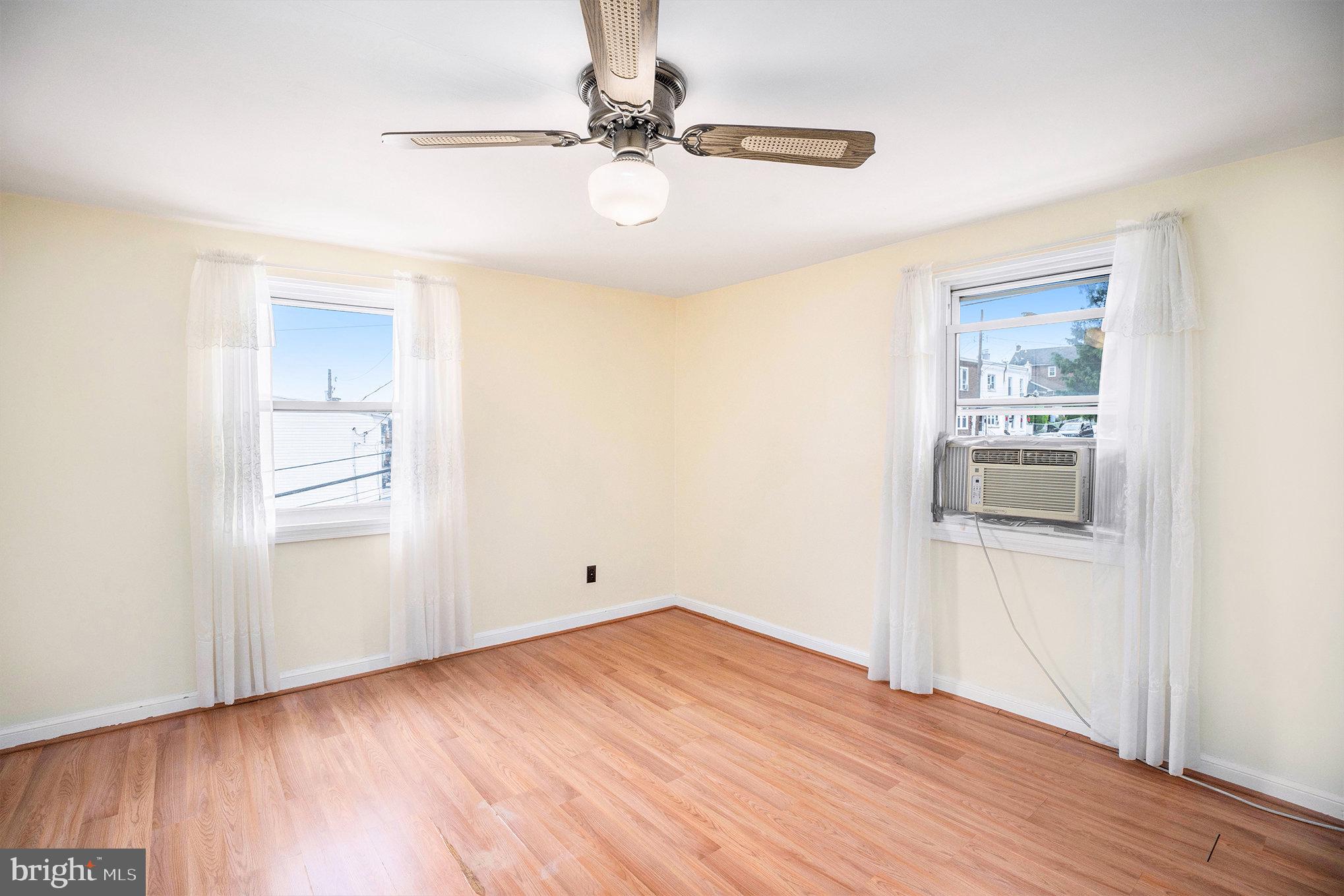 326 East Rambo Street Bridgeport, PA 19405 - Photo 16 of 26 a view of an empty room with wooden floor and a window