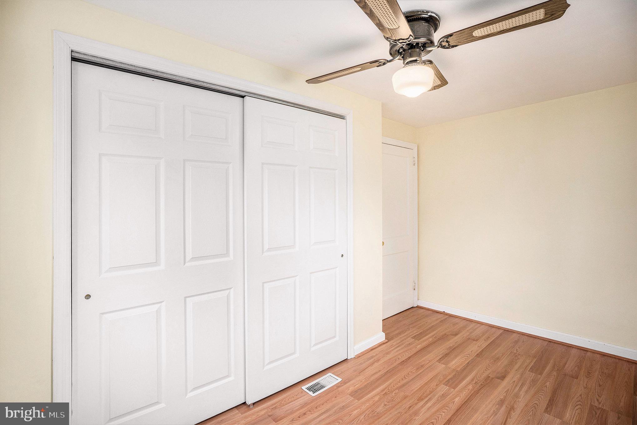 326 East Rambo Street Bridgeport, PA 19405 - Photo 19 of 26 an empty room with wooden floor and fan