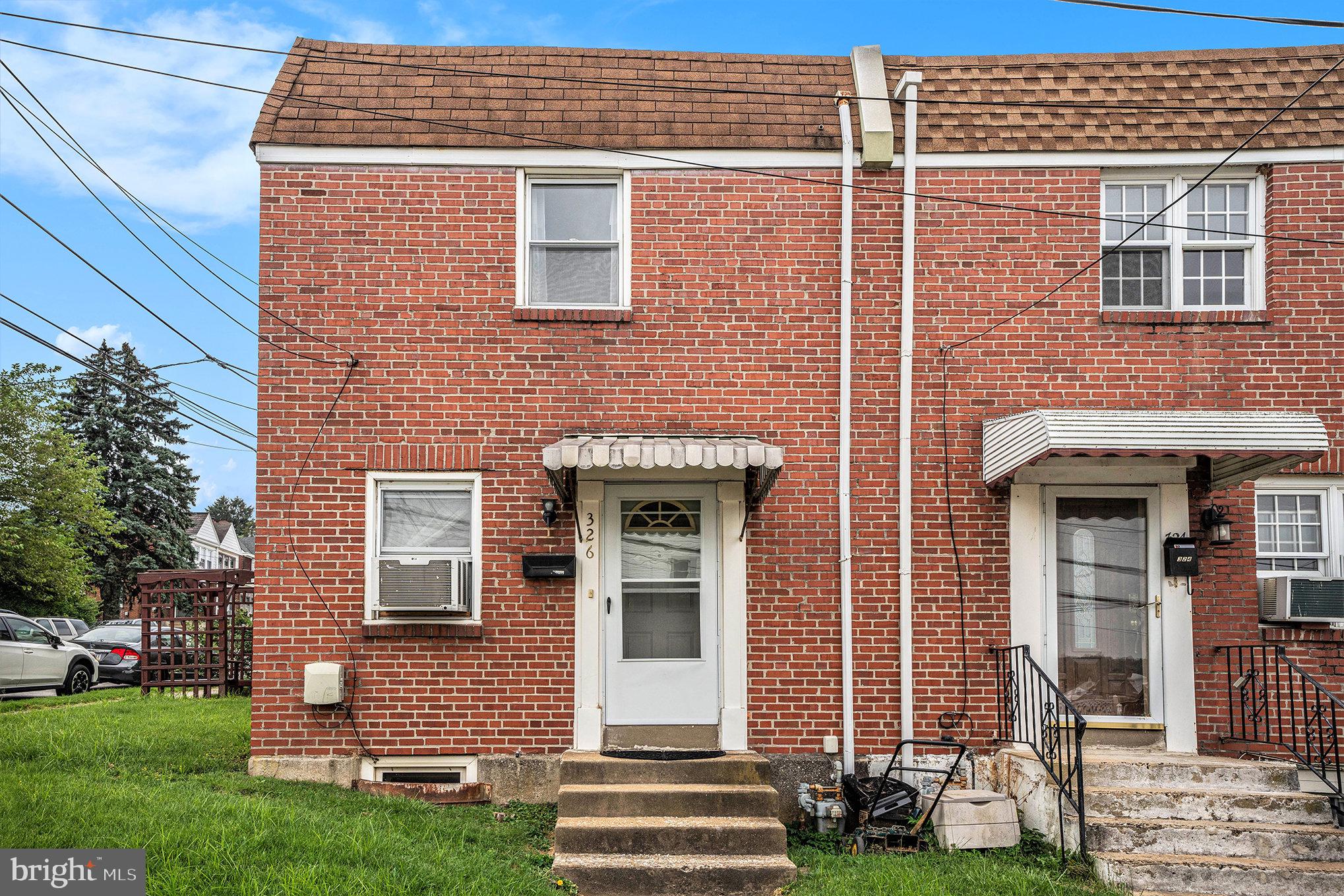 326 East Rambo Street Bridgeport, PA 19405 - Photo 26 of 26 a front view of a house with garden
