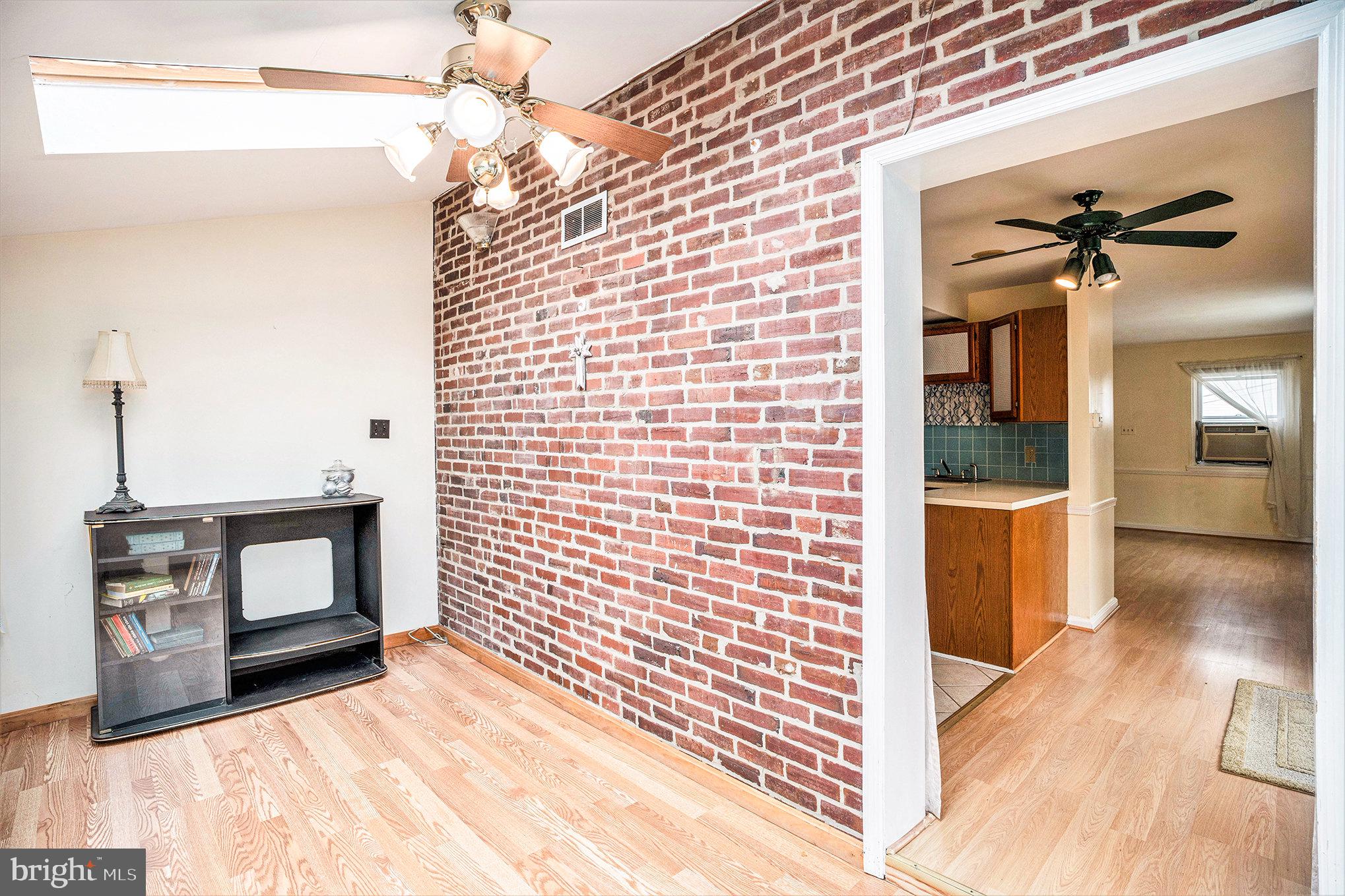 326 East Rambo Street Bridgeport, PA 19405 - Photo 6 of 26 a view of a hallway with wooden floor and a chandelier