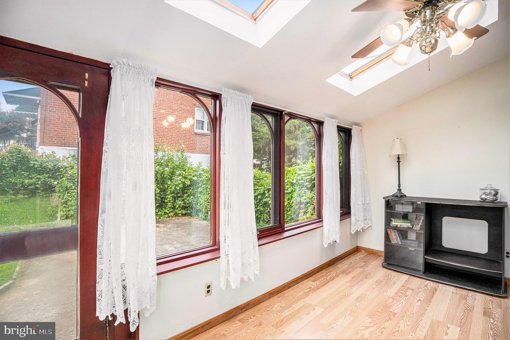 326 East Rambo Street Bridgeport, PA 19405 - Photo 7 of 26 a view of an empty room with a fireplace and a window