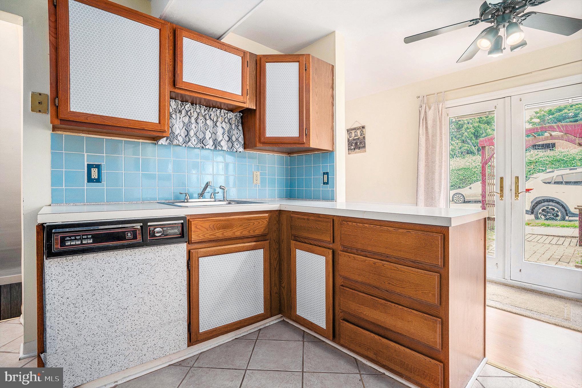326 East Rambo Street Bridgeport, PA 19405 - Photo 9 of 26 a kitchen with stainless steel appliances granite countertop a sink and a stove next to a window