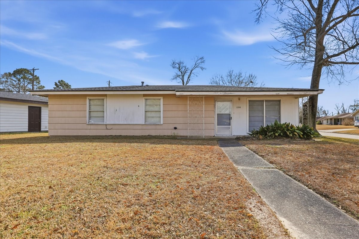 a front view of a house with yard
