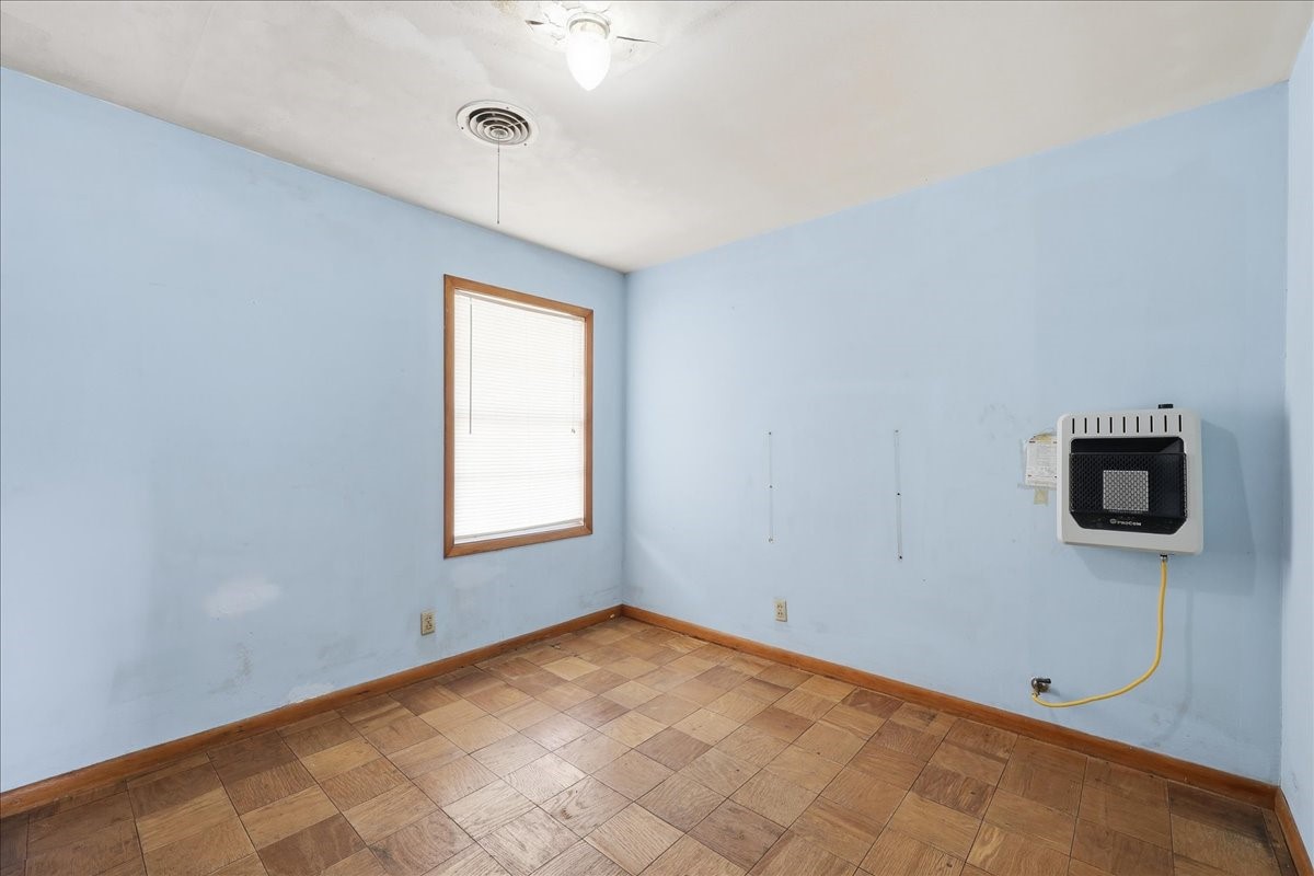 1709 West Robin Avenue Orange, TX 77632 - Photo 12 of 24 a view of an empty room with a window