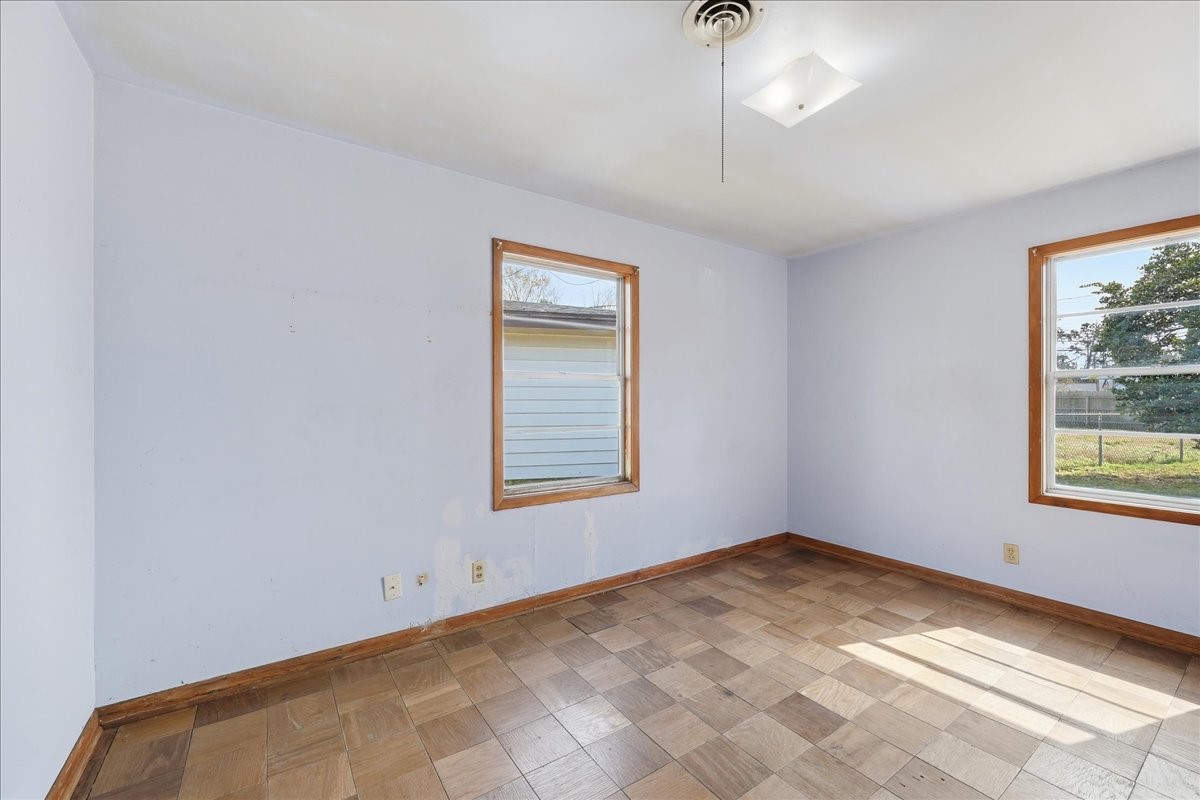 1709 West Robin Avenue Orange, TX 77632 - Photo 15 of 24 an empty room with a window