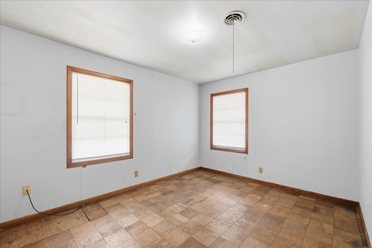 1709 West Robin Avenue Orange, TX 77632 - Photo 17 of 24 a view of an empty room with a window