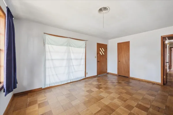 a view of an empty room with a window