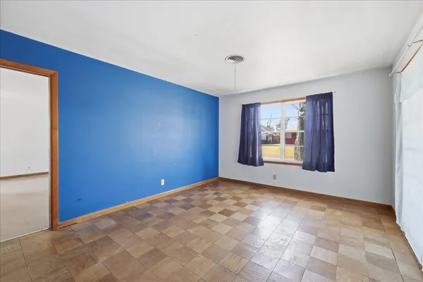 a view of an empty room with a window