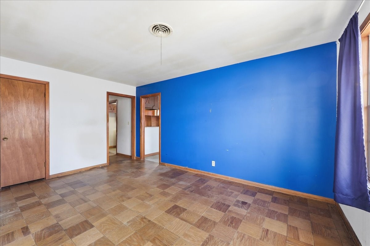 1709 West Robin Avenue Orange, TX 77632 - Photo 6 of 24 a view of an empty room with a window