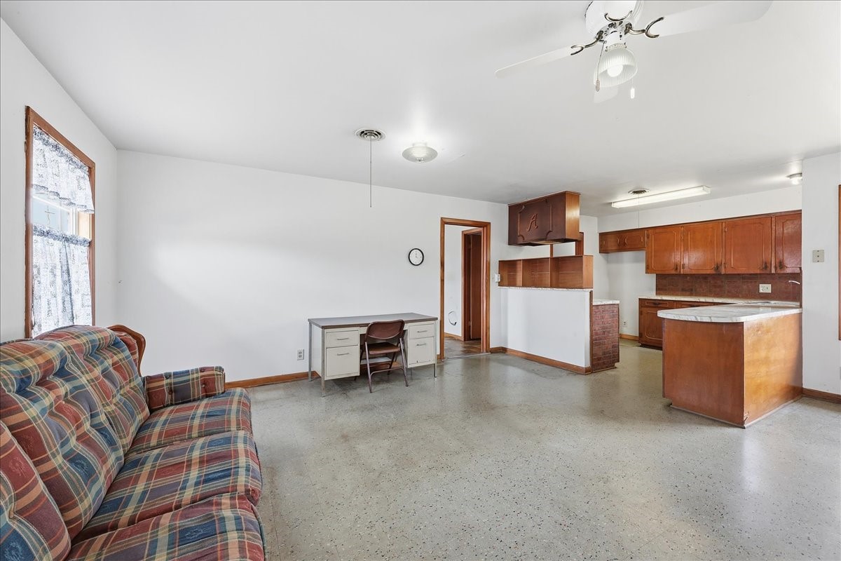 1709 West Robin Avenue Orange, TX 77632 - Photo 8 of 24 a living room with furniture and kitchen view