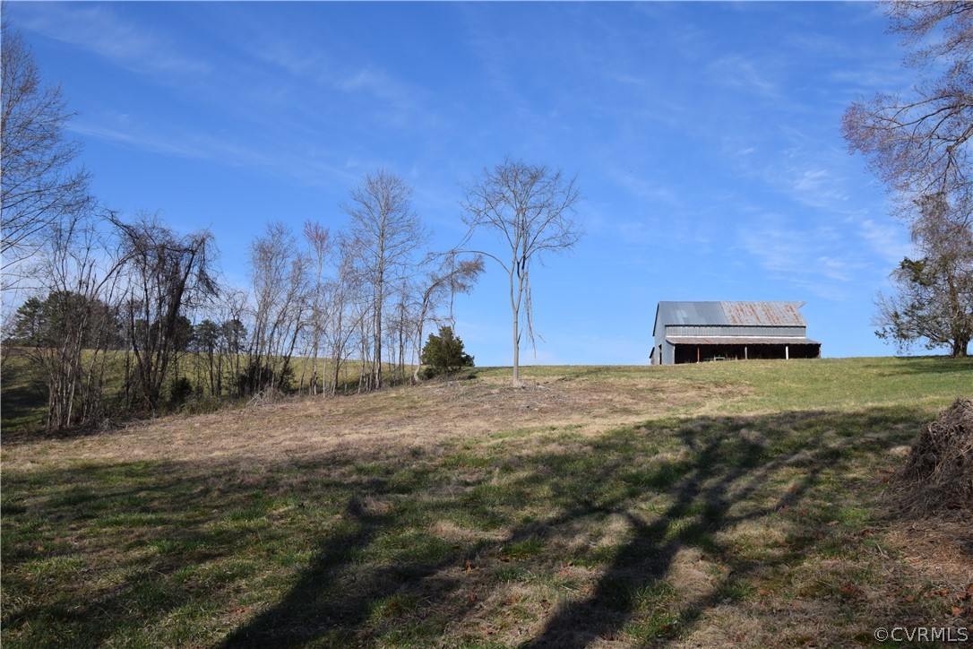 16600 Sandy Ford Road Chesterfield, VA 23838 - Photo 15 of 50 a backyard of a house with lots of green space