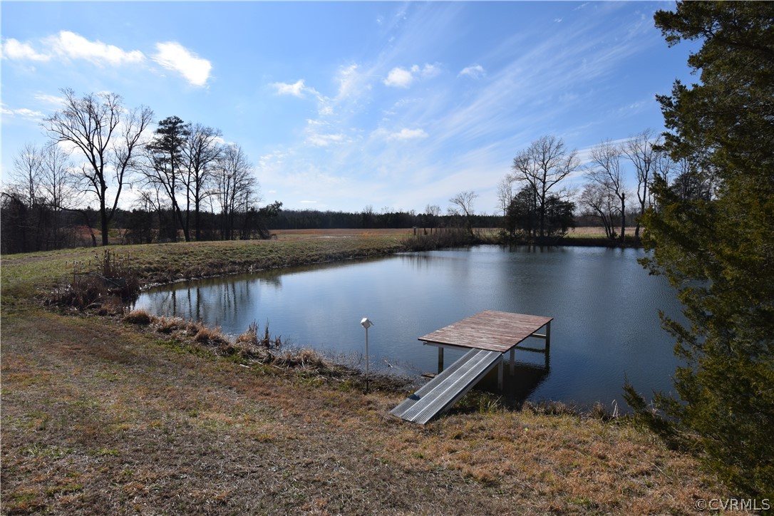16600 Sandy Ford Road Chesterfield, VA 23838 - Photo 29 of 50 a view of a lake with a building in the background