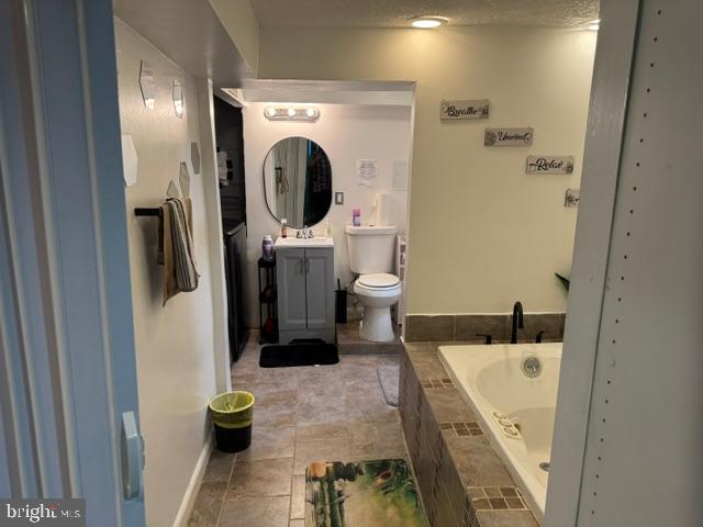 4603 Raleigh Road Temple Hills, MD 20748 - Photo 11 of 40 a bathroom with a sink a mirror and shower