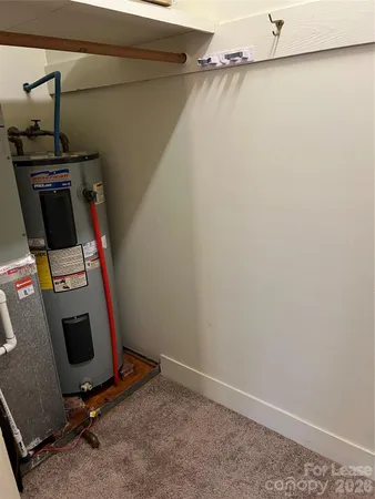 a view of storage and utility room with empty racks